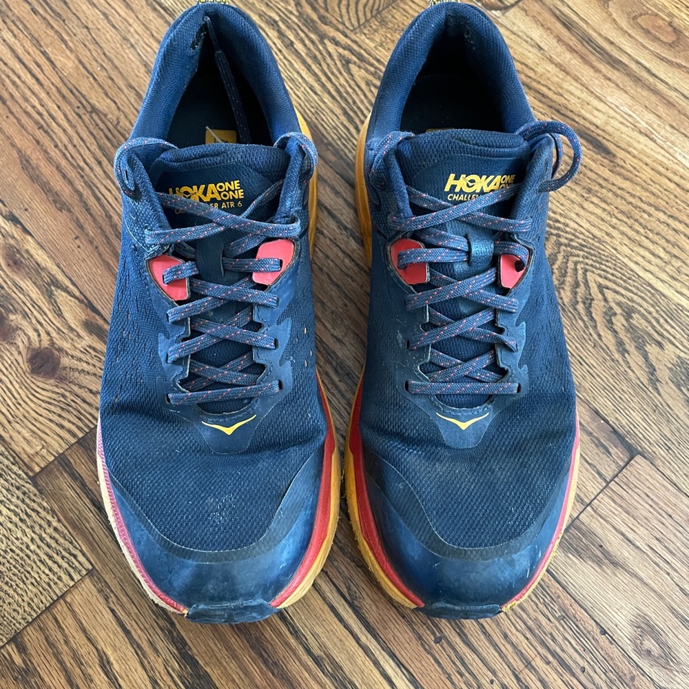 Hoka Men's Navy Blue Trail Runners with Red and Yellow Accents